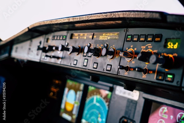 Obraz Cockpit of an Airbus A320 in cruise from the first officer seat