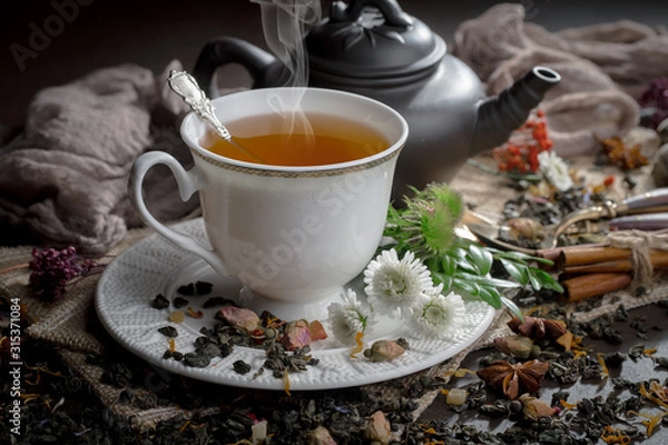 Fototapeta Tea hot drink on old background in composition on the table