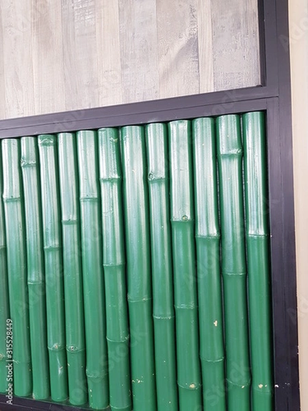 Fototapeta Closeup of green bamboos decoration copy space. Interior design concept.