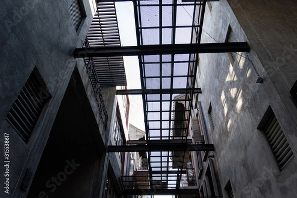 Fototapeta The sky in alley with loft architecture Concrete Cement style . Modern chinese loft architecture  background