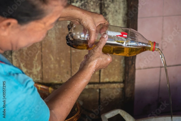 Fototapeta elderly Asian women and used oil