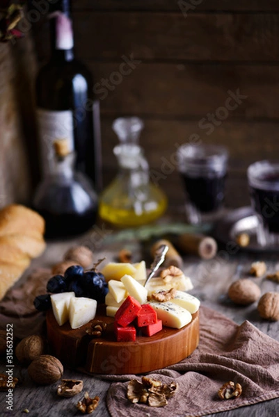 Fototapeta cheese on the cutting board. selective focus