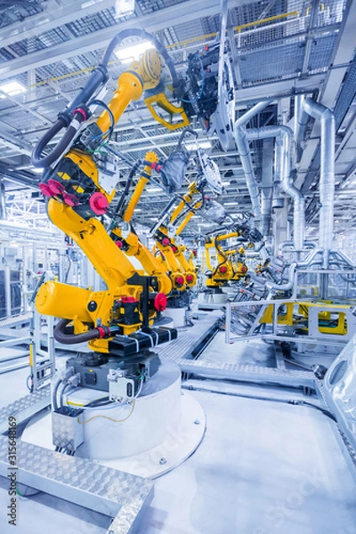 Fototapeta robots in a car plant