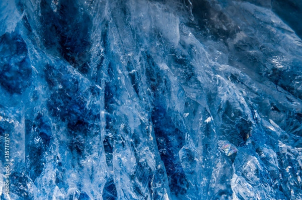 Obraz A close up macro photograph of a cut and polished blue agate crystal stone geode texture