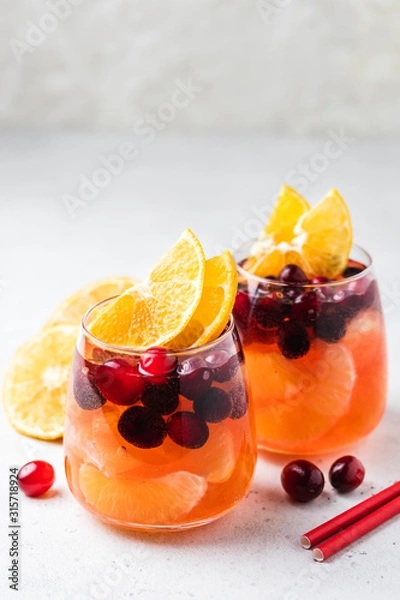 Fototapeta Sparkling cranberry orange cocktail. Selective focus, copy space.
