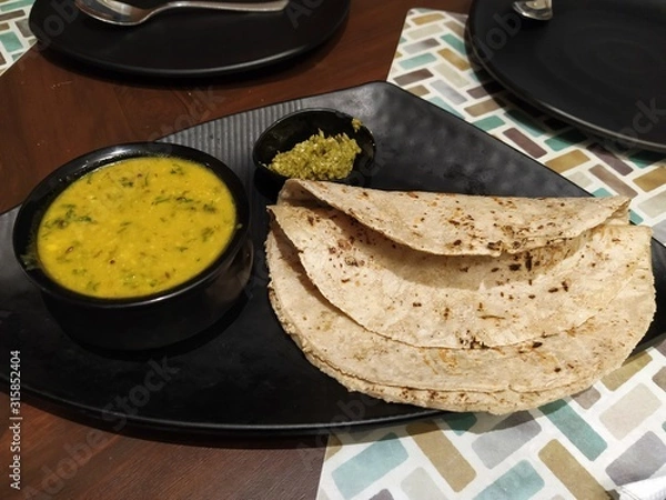 Obraz Traditional Maharastrian food- Pithal Bhakri served with dry curry. 