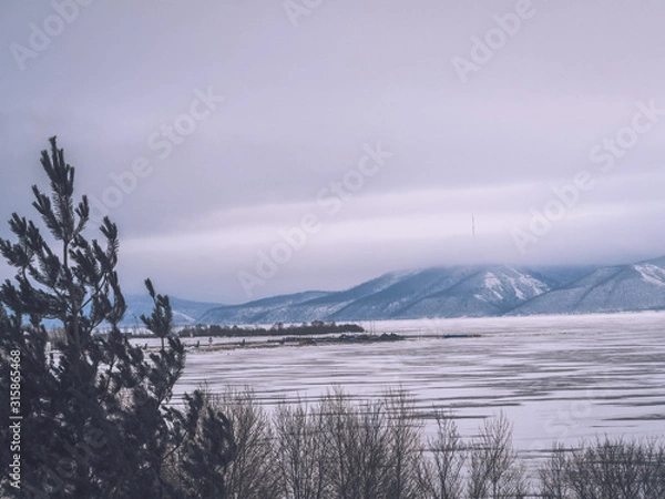Fototapeta Ice landscape, endless panorama of the ice surface on the frozen river