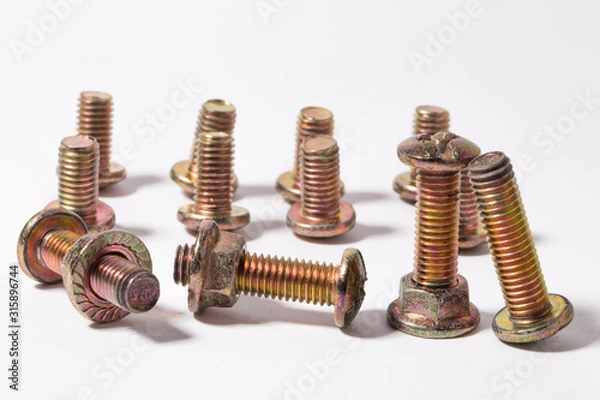 Fototapeta Rusty screw and nuts isolated on white background. Bolts and nuts