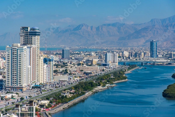 Fototapeta Aerial view of Ras al Khaimah, United Arab Emirates north of Dubai, looking at the city, , Jebal Jais - and along the Corniche.