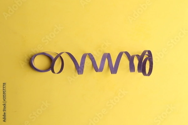 Fototapeta party streamers on colorful background