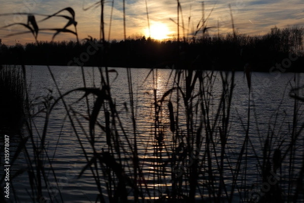 Obraz mit einem Sonnenuntergang