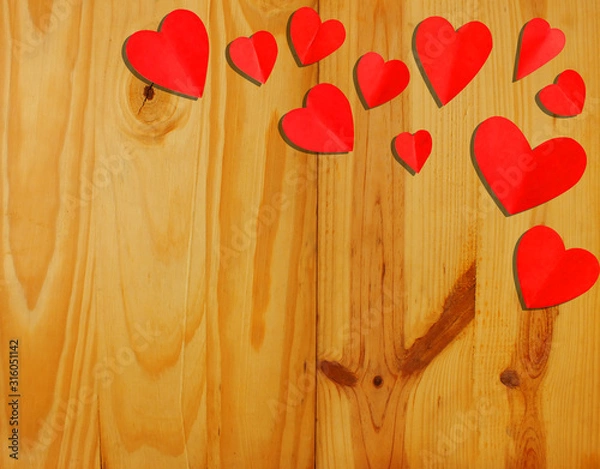 Obraz Valentine's Day. heart shaped red paper on a wooden background