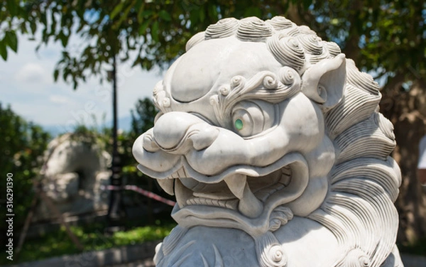 Obraz Vietnamese dragon. A symbolic creature in Vietnamese mythology. The statue is made of white marble.