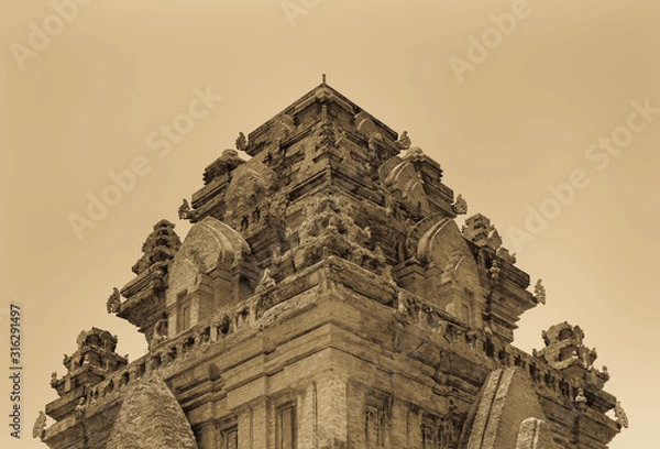 Obraz Antique look of Cham temple tower, Vietnam. Hinduism laid the foundations of the culture and architecture of the kingdom of Cham, which existed in the 9th and 10th centuries AD.