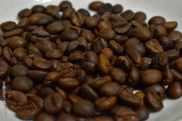 Fototapeta Roasted coffee beans on a substrate.