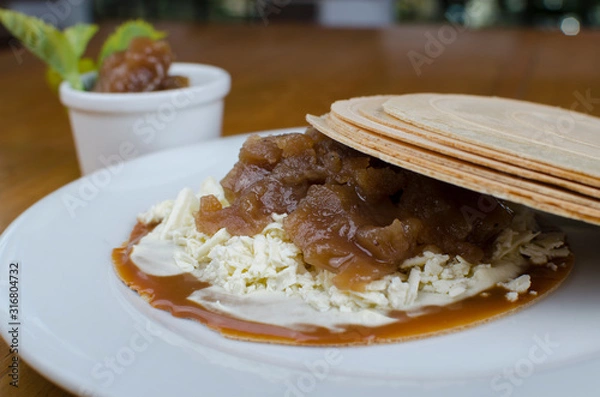 Fototapeta Wafer, traditional Colombian dessert, chopped fruit cookie and sauces