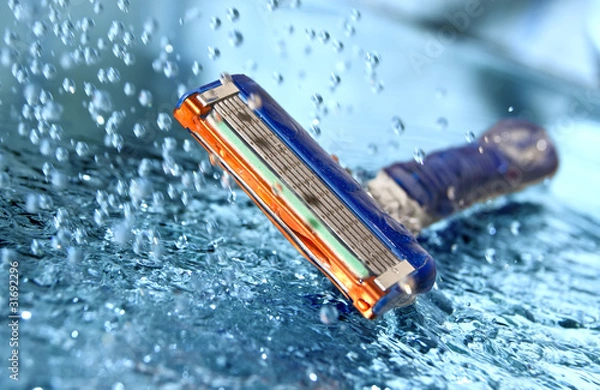 Obraz Razor with water splash