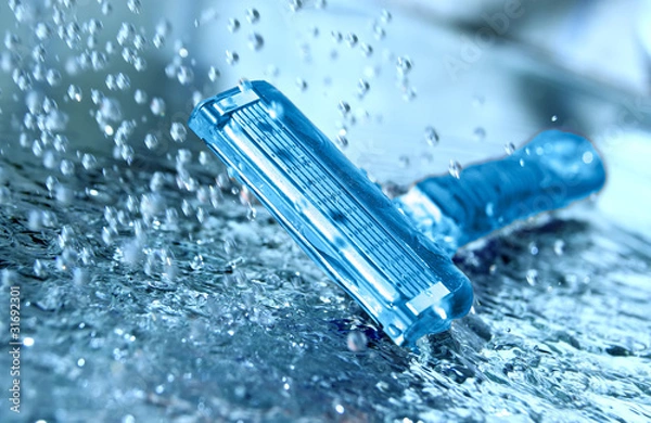 Obraz Razor with water splash