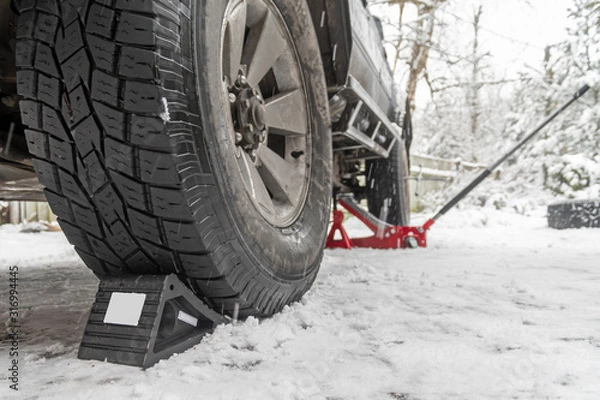 Obraz Wheel Chocks anti-skid. Prevent tires from rolling by set chock on front wheel on rough ground. Triangular anti-slip base
