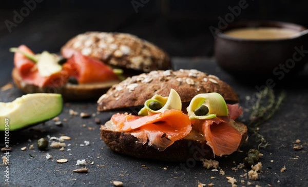 Fototapeta Sandwich with salmon and avocado