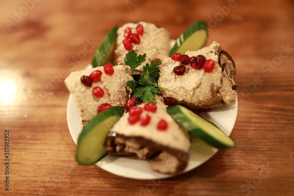 Fototapeta Eggplant rolls with nuts and cucumbers