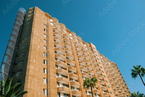 Obraz Concrete modernist building sunny day blue sky low angle