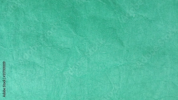 Fototapeta  green crumpled paper close-up horizontal orientation