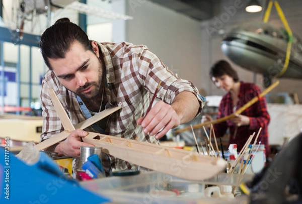 Fototapeta Male hobbyist creating plane models