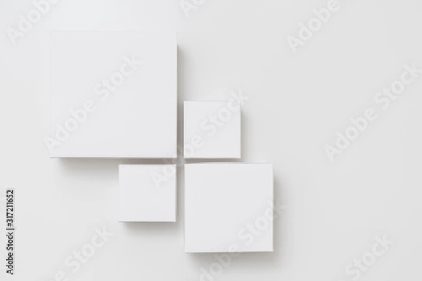 Fototapeta Mock up of four different size white boxes on the white background