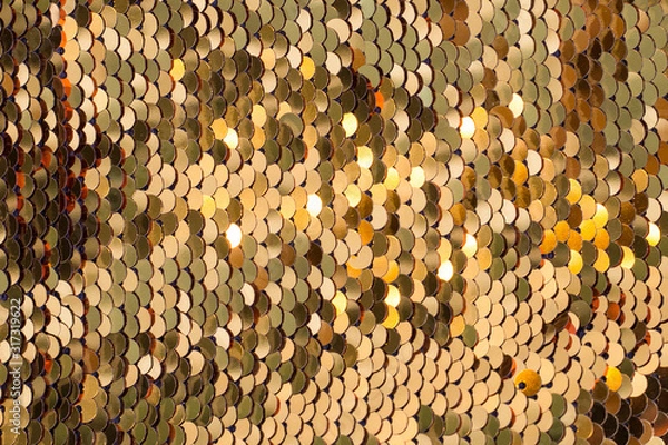 Fototapeta Background from gold glitter paillettes, close up. Metallic Glitter background , Golden sequins, sparkling sequined textile