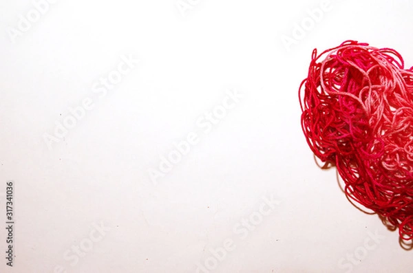Obraz Red heart made of threads on a white background Valentine's Day banner place under text