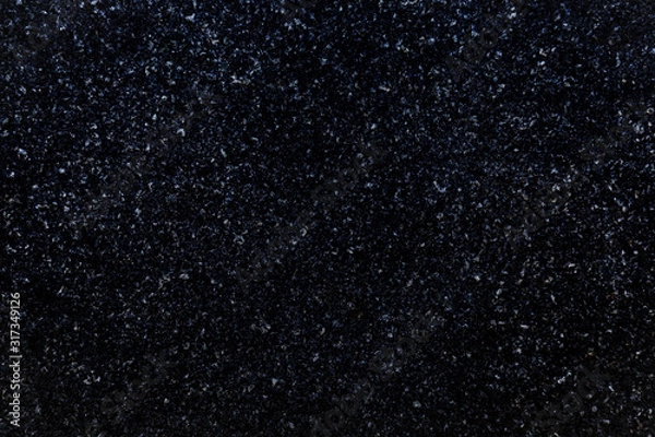 Fototapeta Close-up of natural granite stone. Abstract dark full frame textured background.