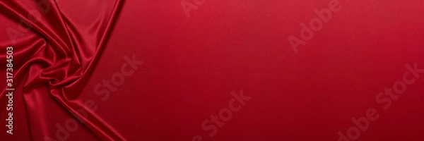 Obraz Abstract background from red silk or satin. Luxury fabric texture with draped. Copy space. Element design. Valentine's day.