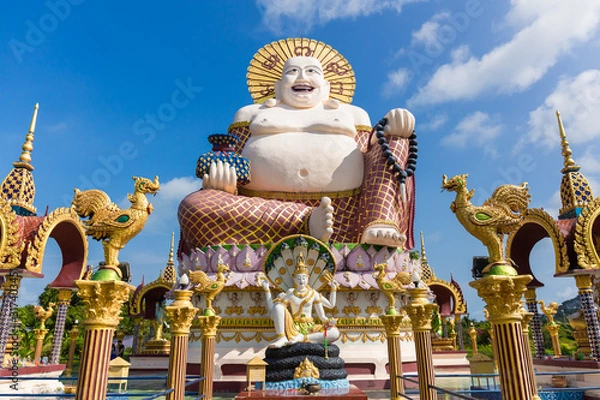 Fototapeta Budai or Pu-Tai or Happy Buddha or Laughing Big Buddha statue at Wat Plai Laem Temple in the Ko-Samui or Samui island in Thailand