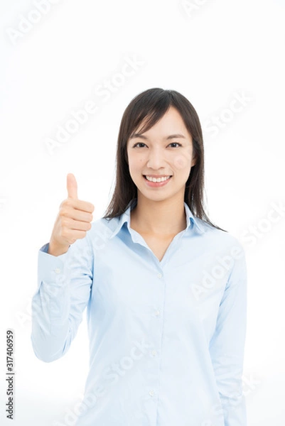 Fototapeta サムアップするビジネスウーマン