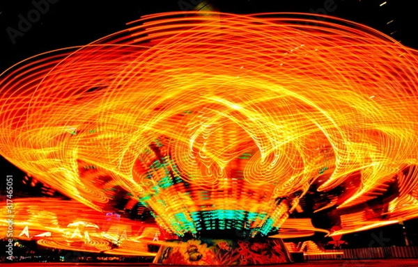 Fototapeta Light painting, lighting from the amusement park players