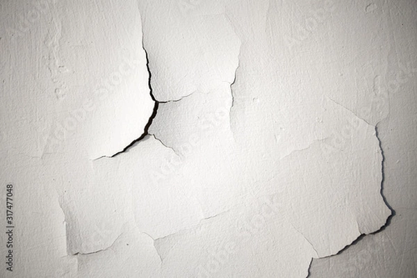 Obraz Cracks on a white plastered wall