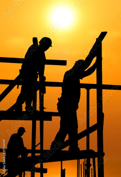 Fototapeta Construction workers under a hot blazing sun