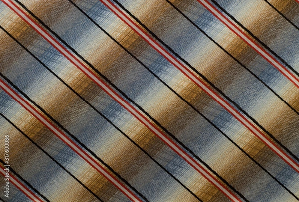 Fototapeta  multi-colored fabric with black, white and red stripes diagonally