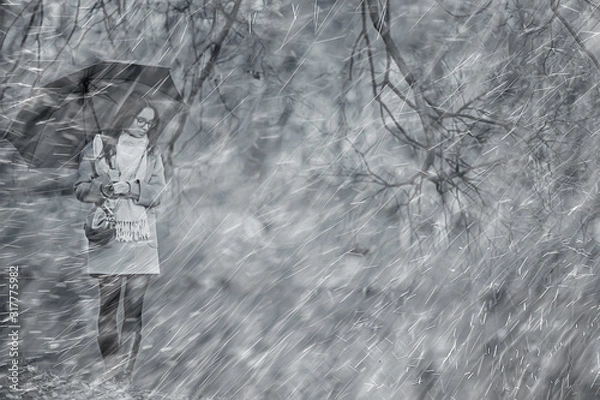 Fototapeta autumn raindrops model / rain weather, girl autumn look, splashes and raindrops in the wind, october in the city