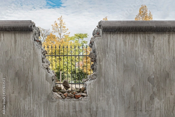 Fototapeta Political barricade that limits freedom. Broken wall that symbolizes freedom