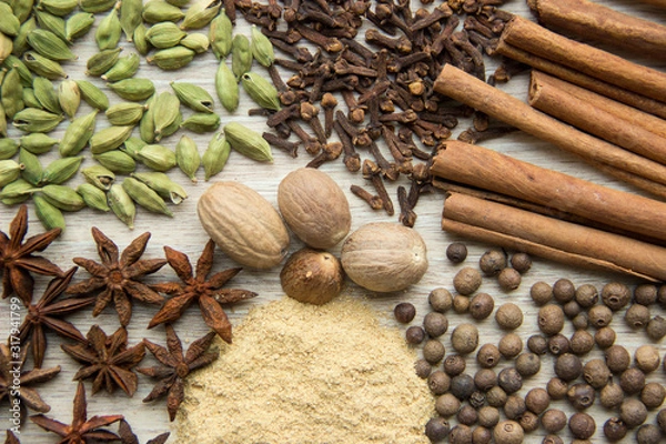 Obraz Flat Lay herbs and spices for mulled wine. Clove, cinnamon, star anise, allspice, nutmeg, cardamom, ginger, east, indian pepper