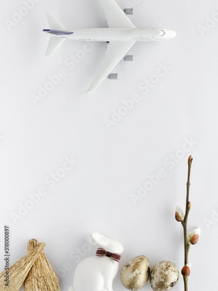 Fototapeta Top view easter composition.Bunny egg airplane creative flat lay background with copy space for your text.
