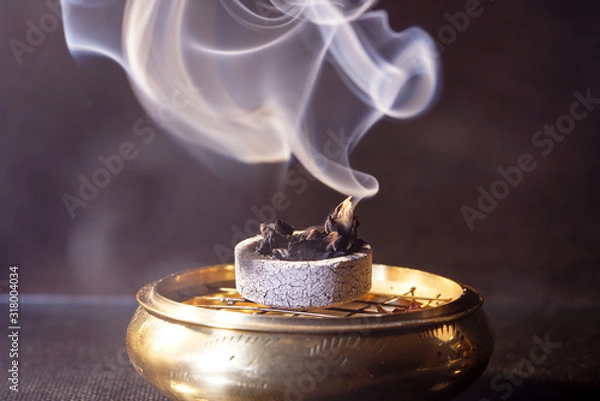 Fototapeta Smoke flashed with colorful foils and photographed in the studio