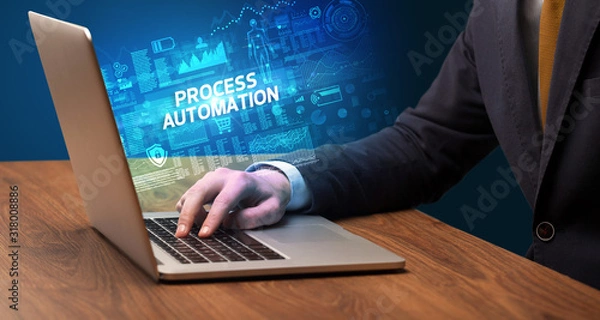Fototapeta Businessman working on laptop with PROCESS AUTOMATION inscription, cyber technology concept