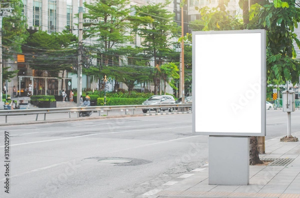 Fototapeta led blank billboard white screen side road in city. ad mockup copy space for advertising banner near bus stop in metropolis.