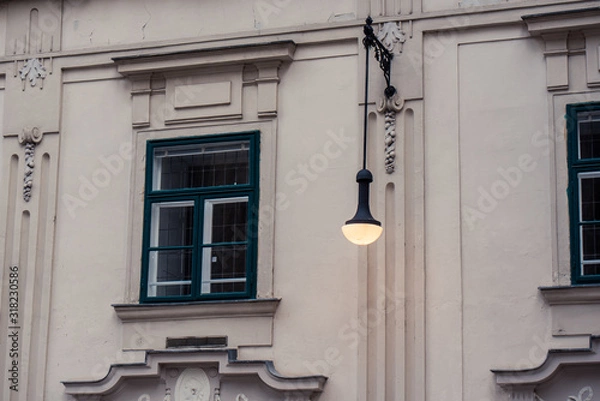 Obraz Cityscape of old window with a lamp