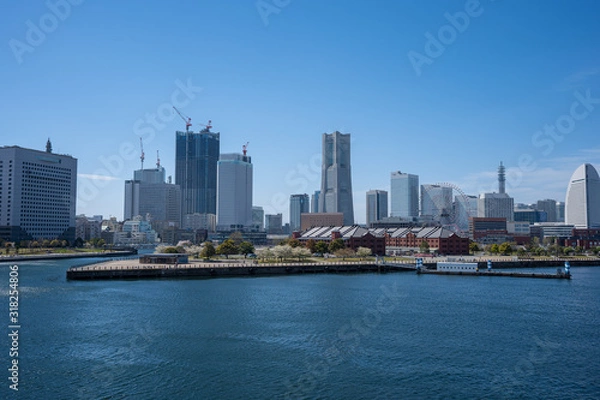 Obraz 空と海とビル群の写真