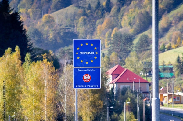 Fototapeta Borders inside Schengen Area between Slovakia and Poland. Best European Community Road Sign indicating National Border of European Union country, near town Piwniczna-Zdroj and Mnisek nad Popradom.