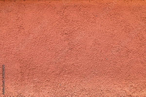 Fototapeta orange concrete wall with many irregularities